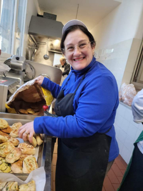 Marie Paoletti, a volunteer at the soup kitchen preparing food.