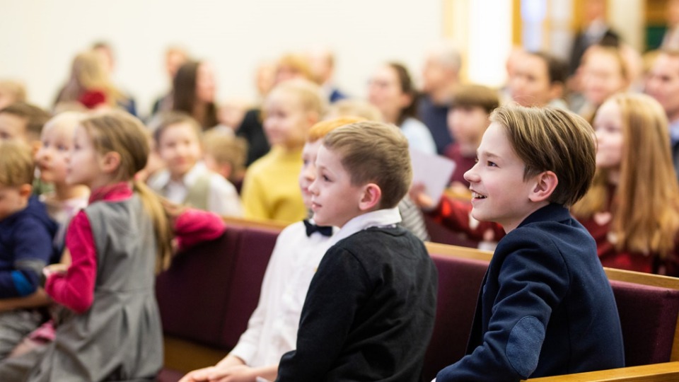 Primary-children-at-Riga-Chapel-in-Riga,-Latvia-on-7-March-2023